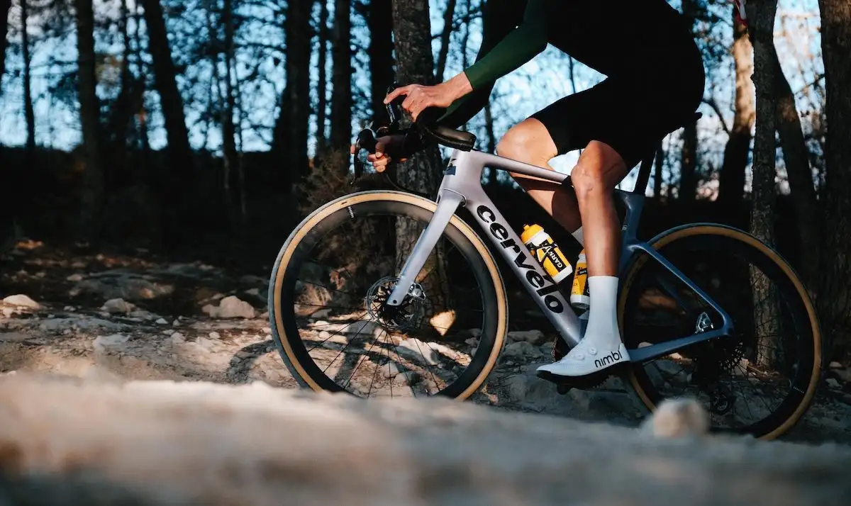 Person in sportive outfit on a Cervelo gravel bike in the forest