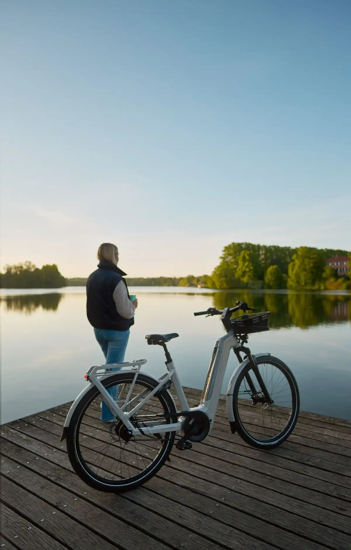 woman is standing at see next to her the bike parking