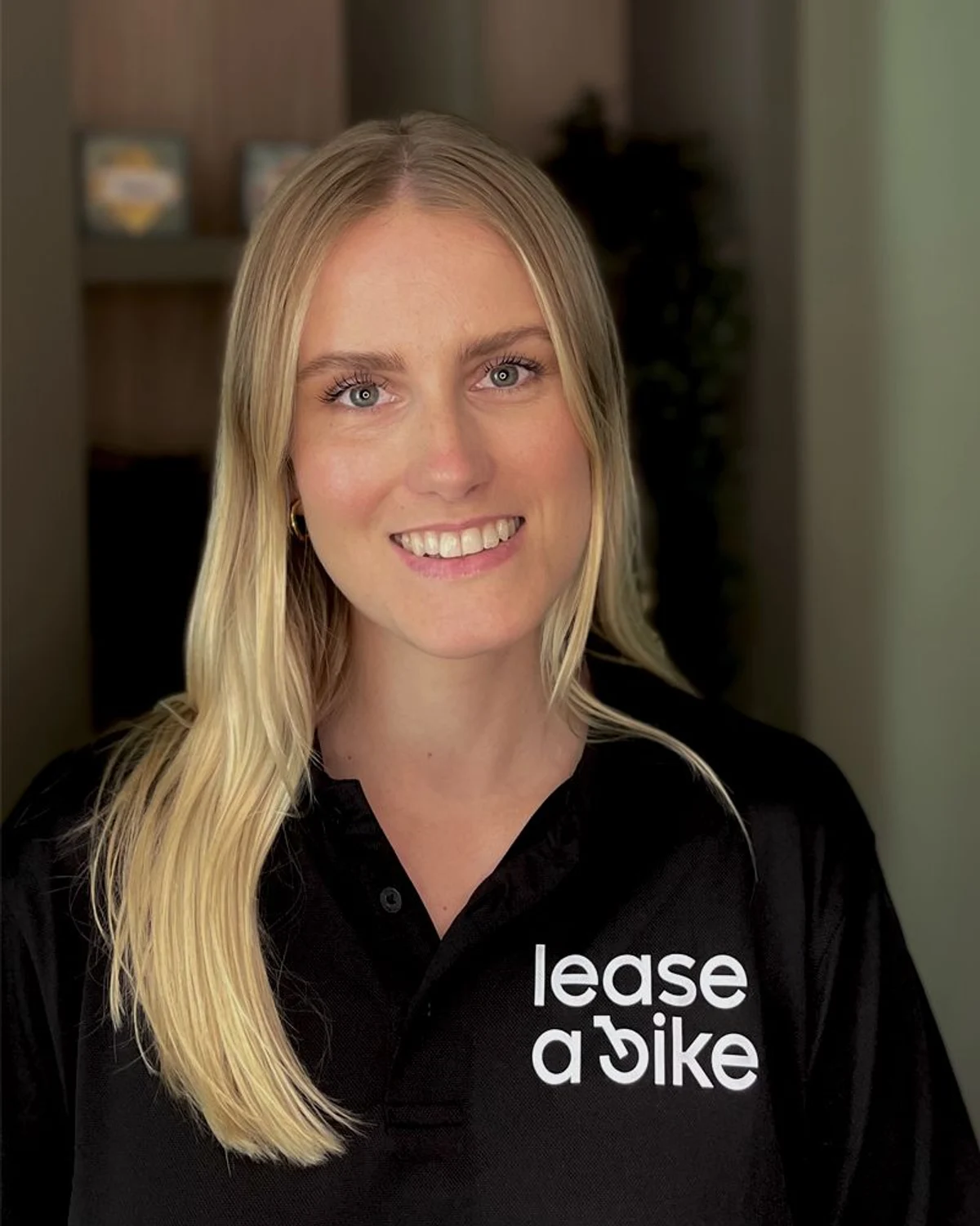 Portrait of Anna Wendt, Team Leader Customer Service & Claims Management at Lease a Bike, wearing a branded polo shirt.