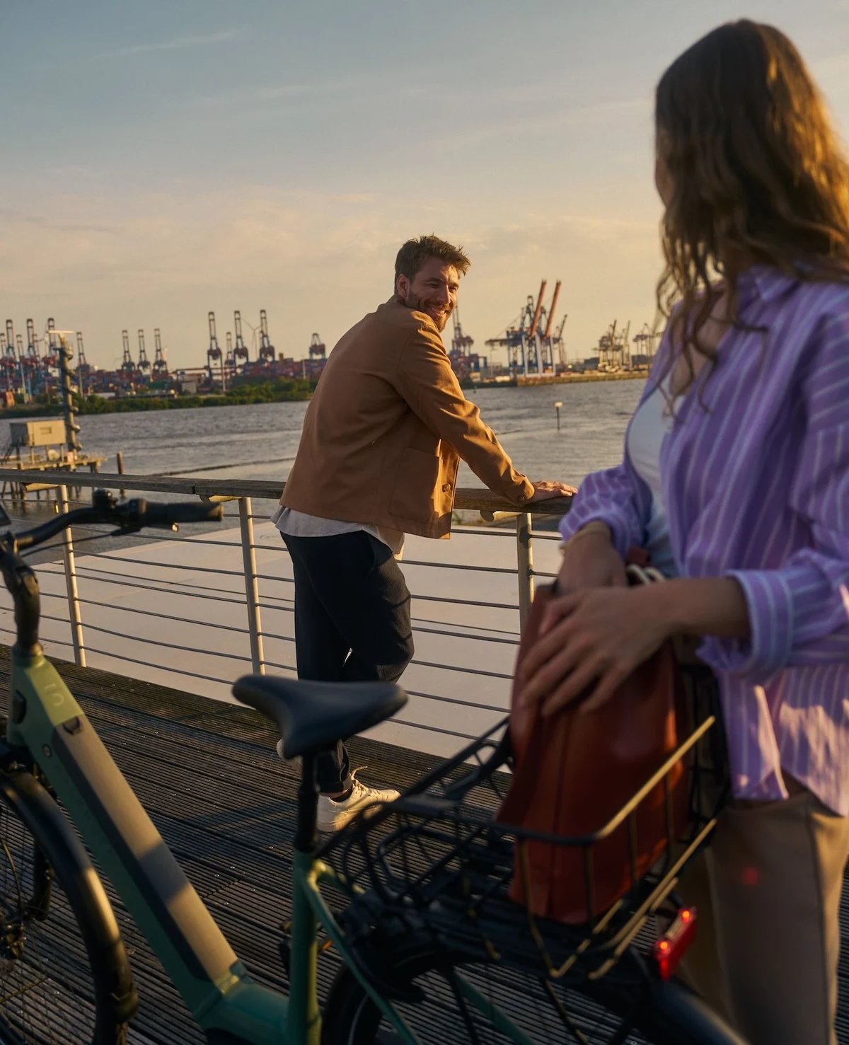 Woman and Man with bike in harbour