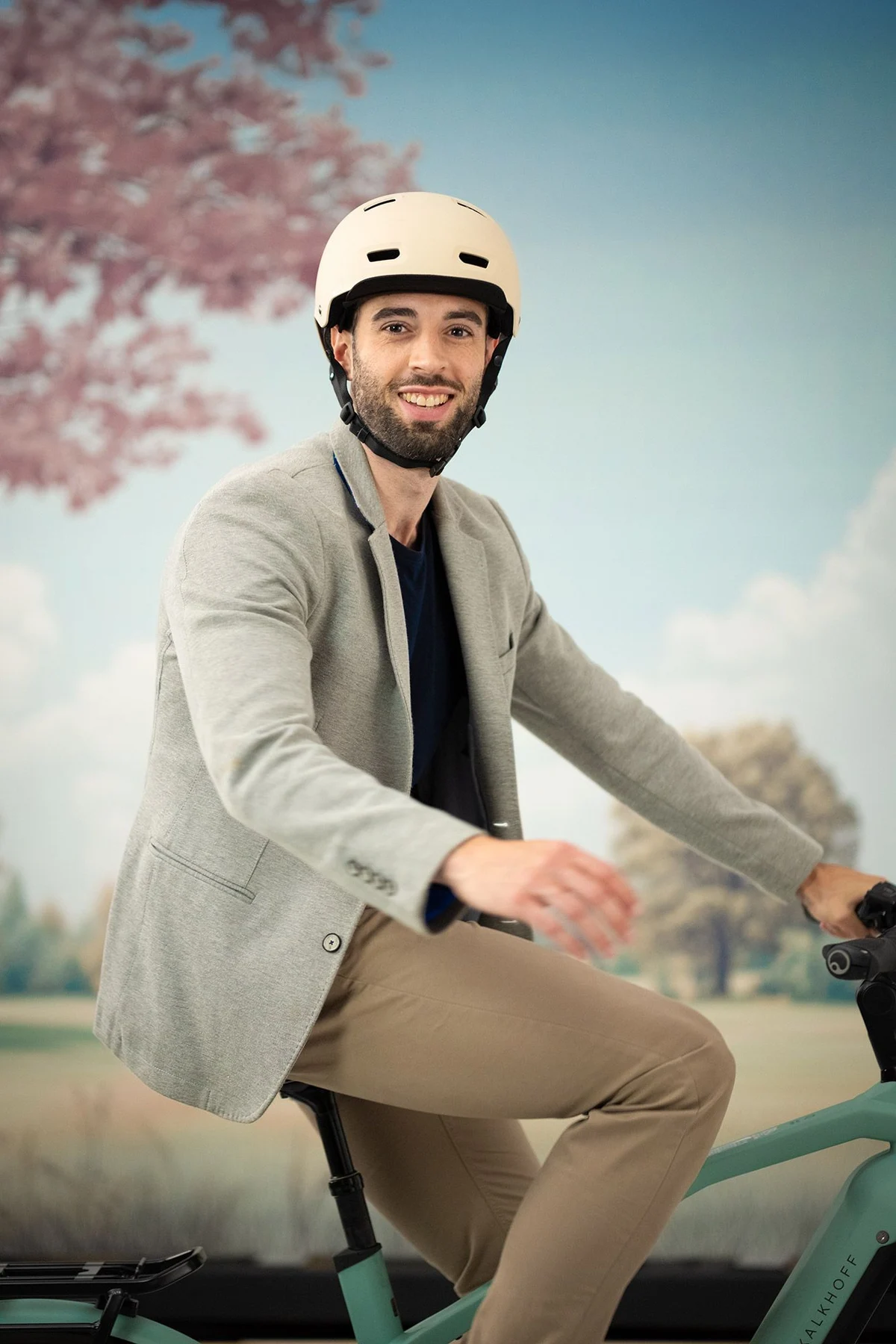 smiling man on e bike looking into camera