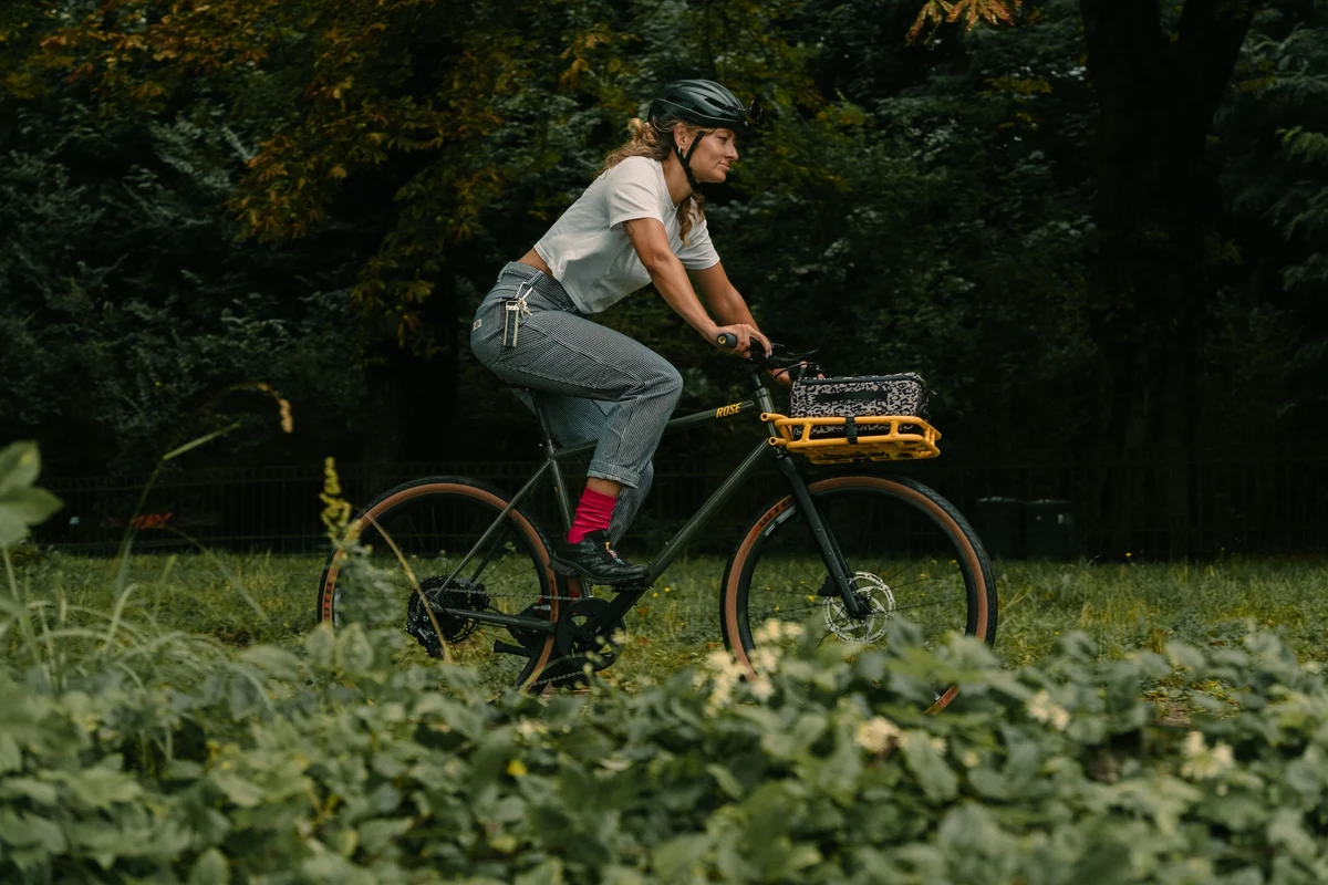woman riding her gravel bike in a park